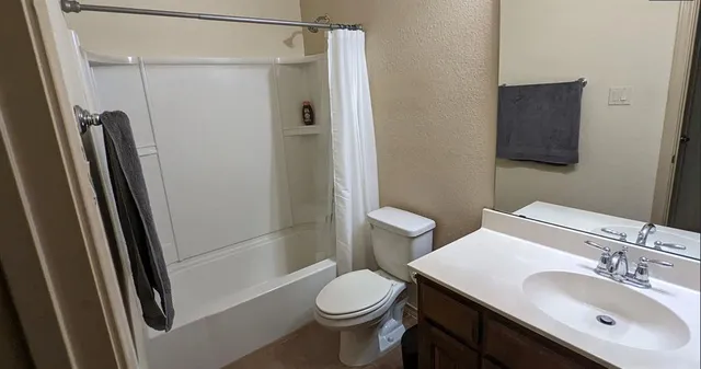 a view of walk in closet with clothes and water camper