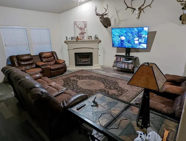 a living room with furniture and a fireplace