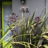 a balcony with furniture and garden view