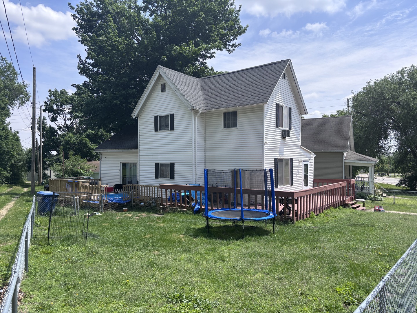 1219 South 7th Street Clinton, IA 52732 - Photo 1 of 15 a view of a house with a backyard and a patio