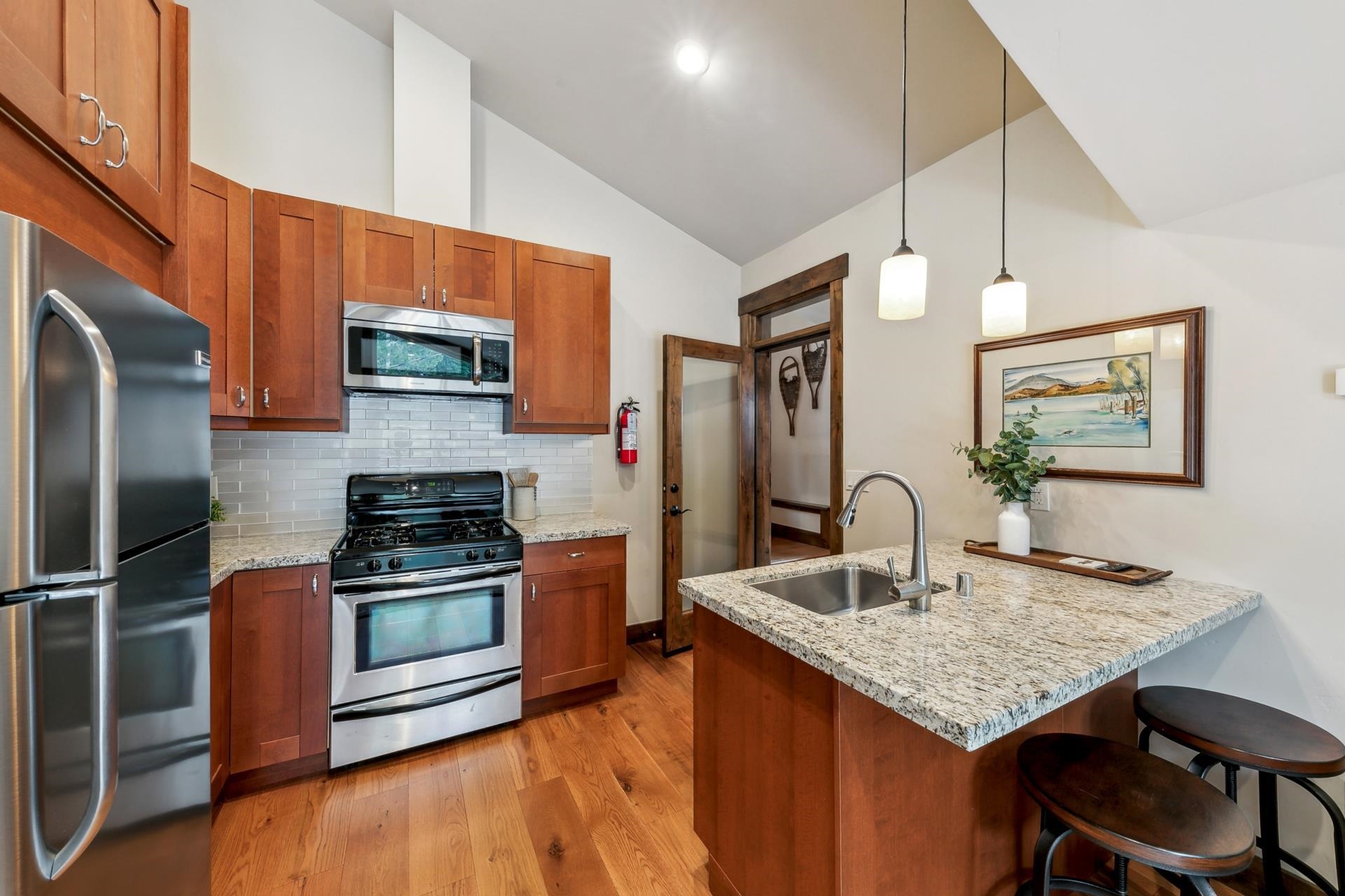 15501 Conifer Drive Truckee, CA 96161 - Photo 21 of 28 a kitchen with stainless steel appliances granite countertop a sink a stove and refrigerator