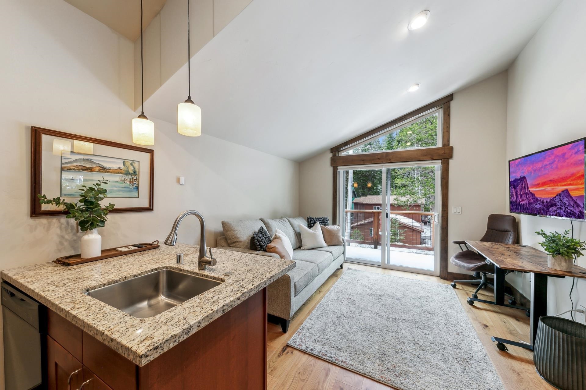 15501 Conifer Drive Truckee, CA 96161 - Photo 22 of 28 a kitchen with a sink a counter and workspace