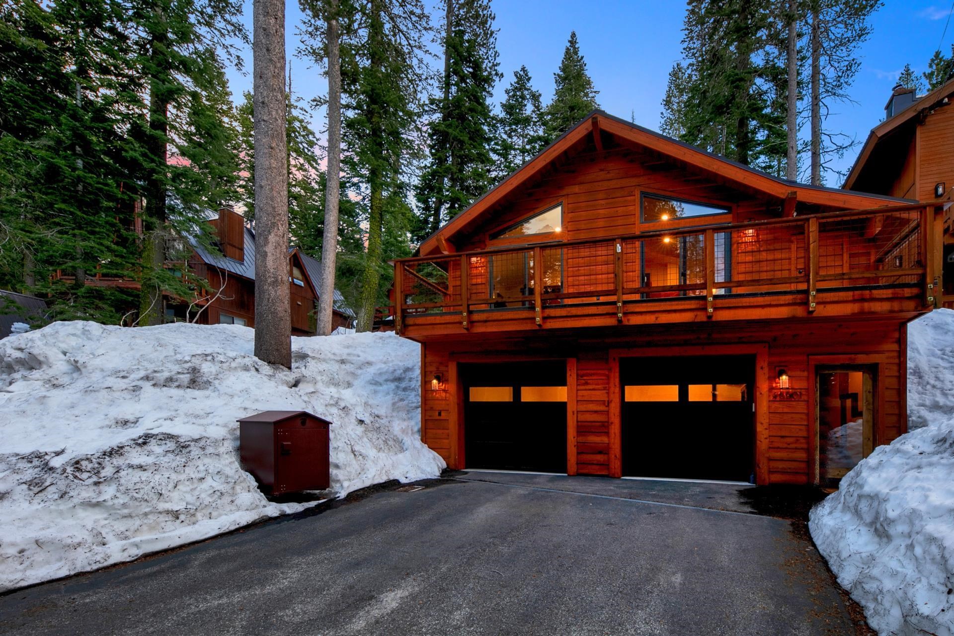 15501 Conifer Drive Truckee, CA 96161 - Photo 26 of 28 a front view of a house with a yard and garage