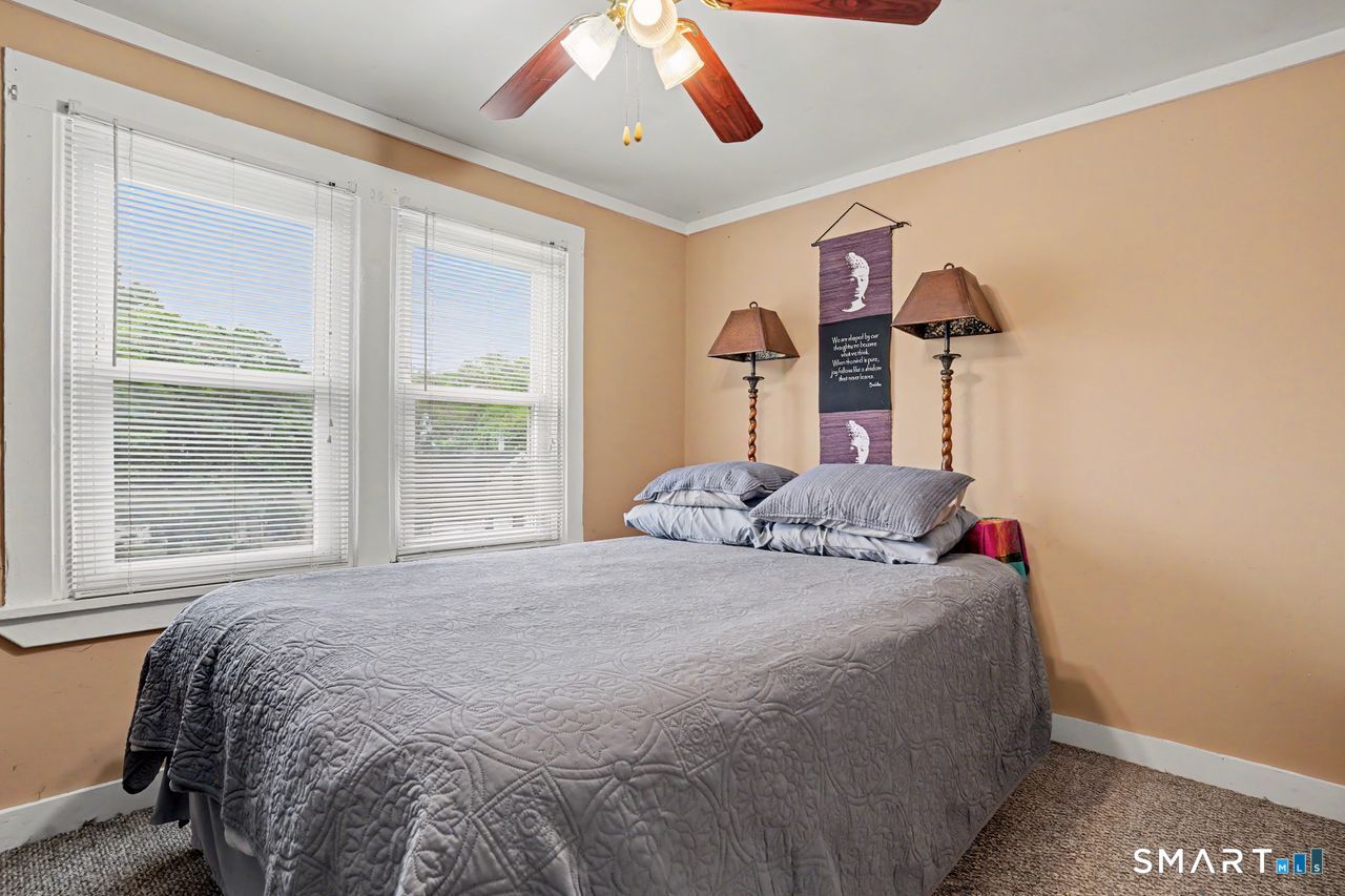 74 Maple Street Seymour, CT 06483 - Photo 20 of 40 a bedroom with a bed and a window