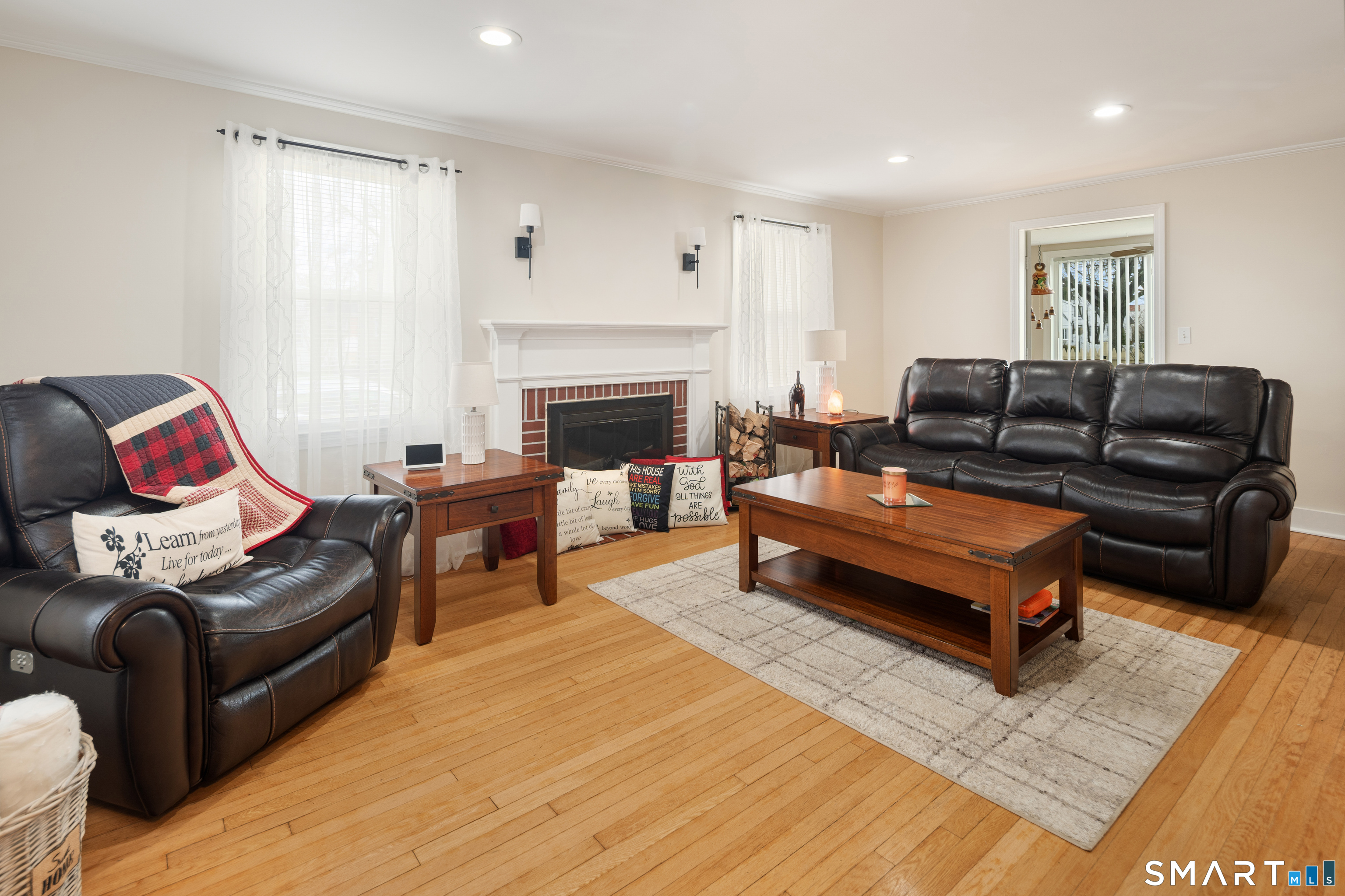 135 Laurel Place Bridgeport, CT 06604 - Photo 14 of 35 a living room with furniture and a fireplace