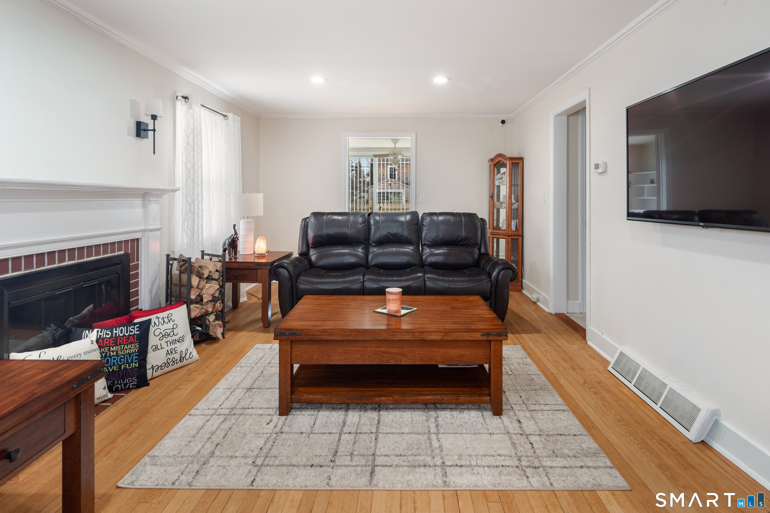 135 Laurel Place Bridgeport, CT 06604 - Photo 15 of 35 a living room with furniture and a flat screen tv