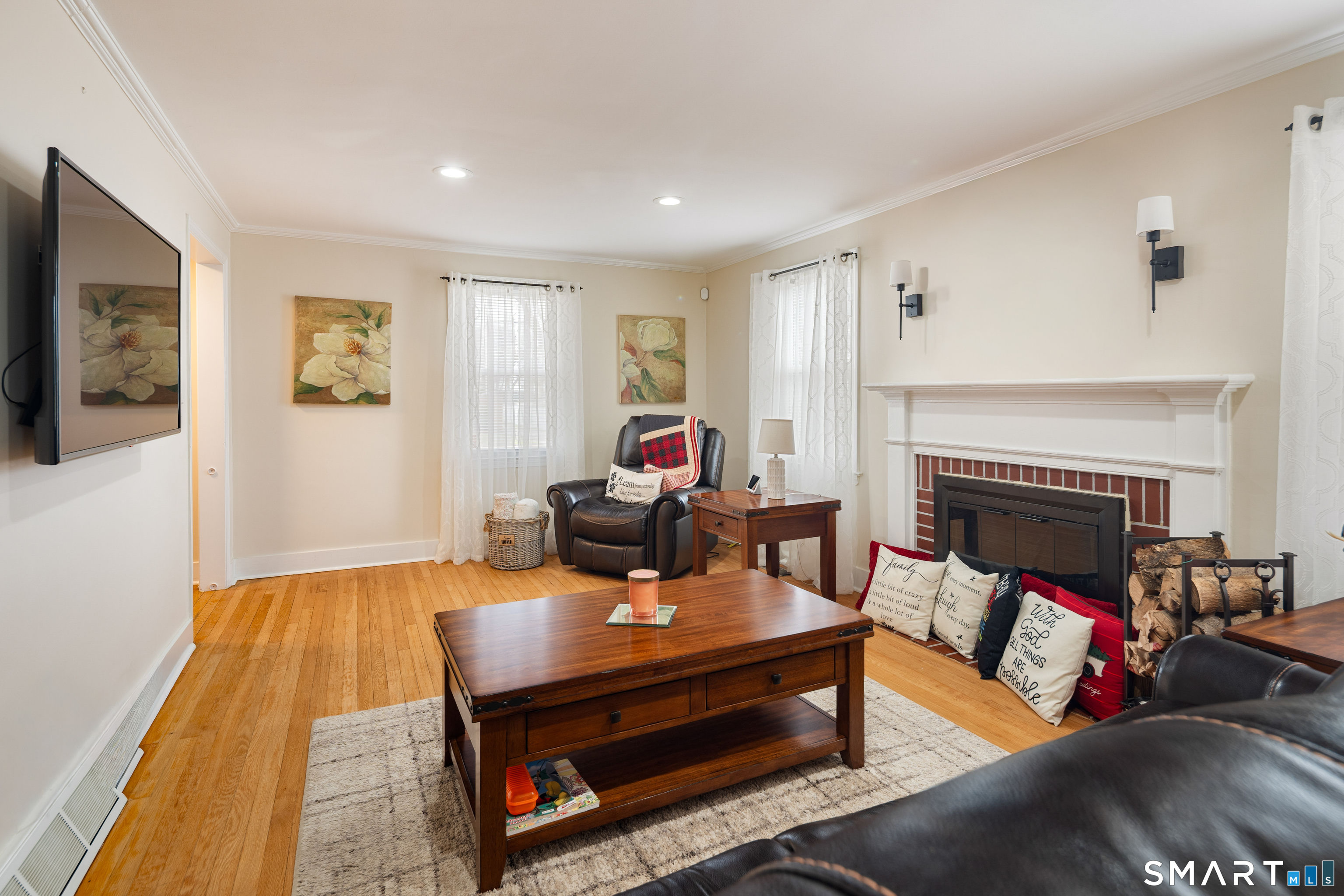 135 Laurel Place Bridgeport, CT 06604 - Photo 16 of 35 a living room with furniture and a fireplace