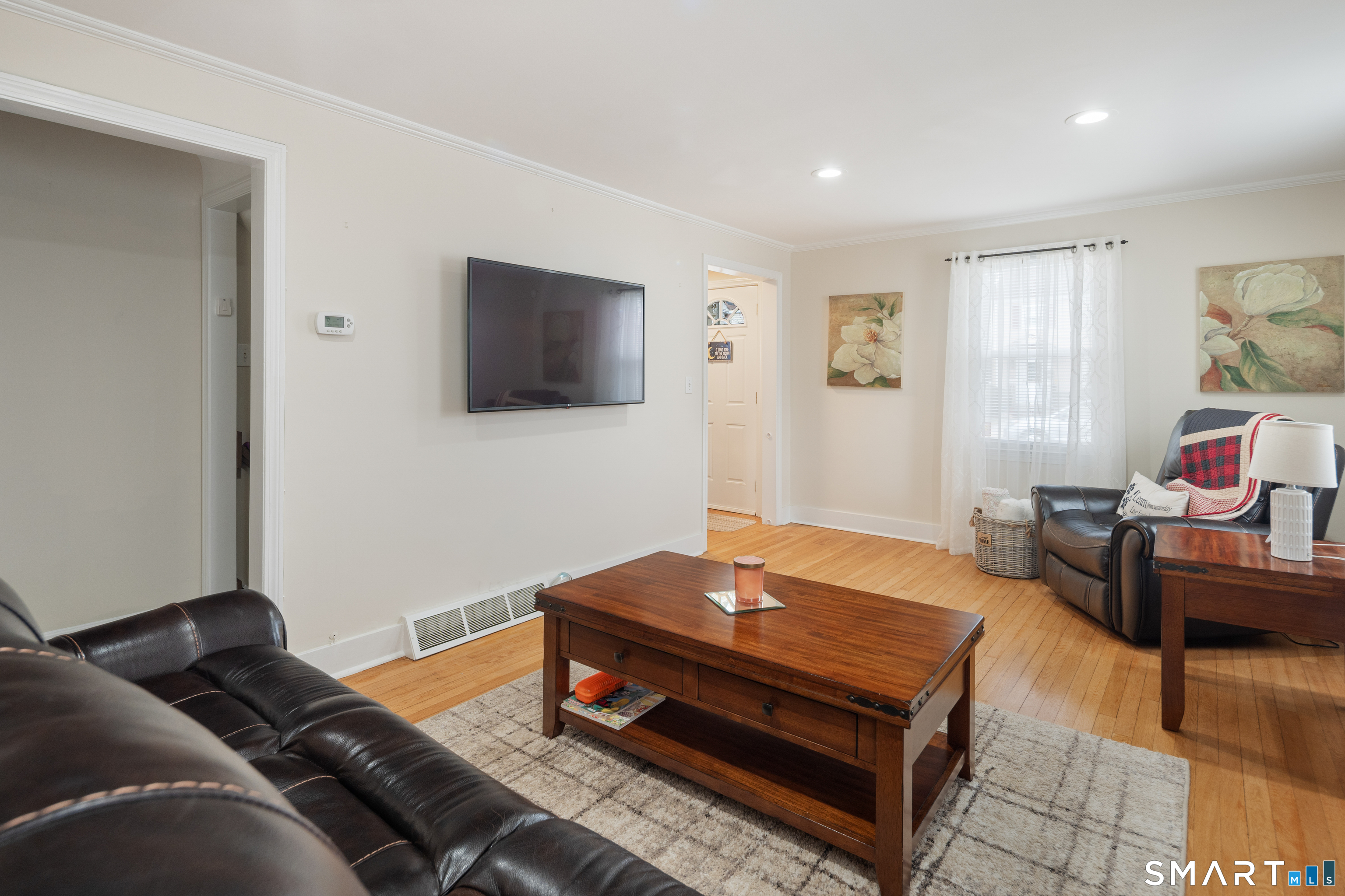 135 Laurel Place Bridgeport, CT 06604 - Photo 17 of 35 a living room with furniture and a flat screen tv