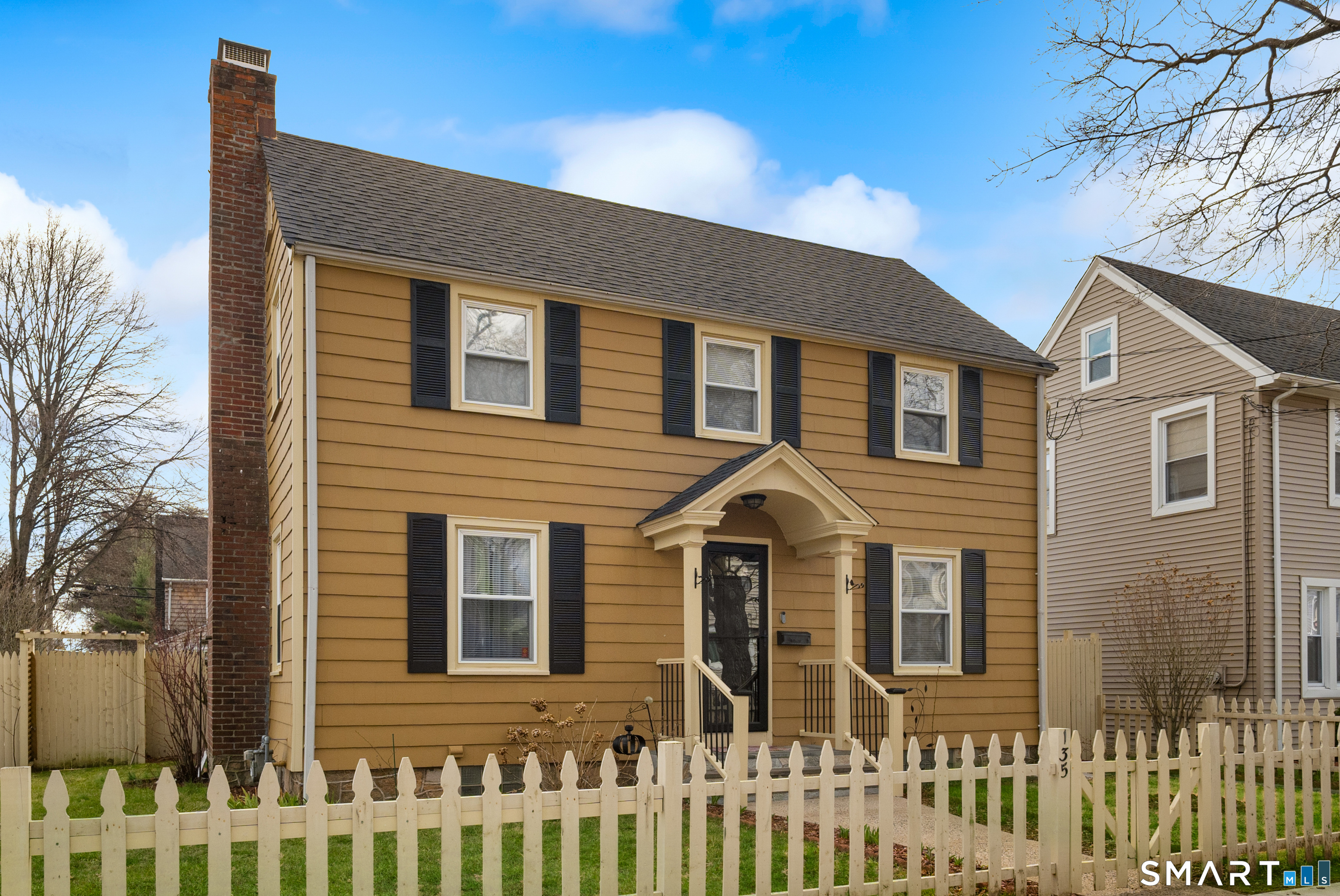 135 Laurel Place Bridgeport, CT 06604 - Photo 2 of 35 a front view of a house with a yard