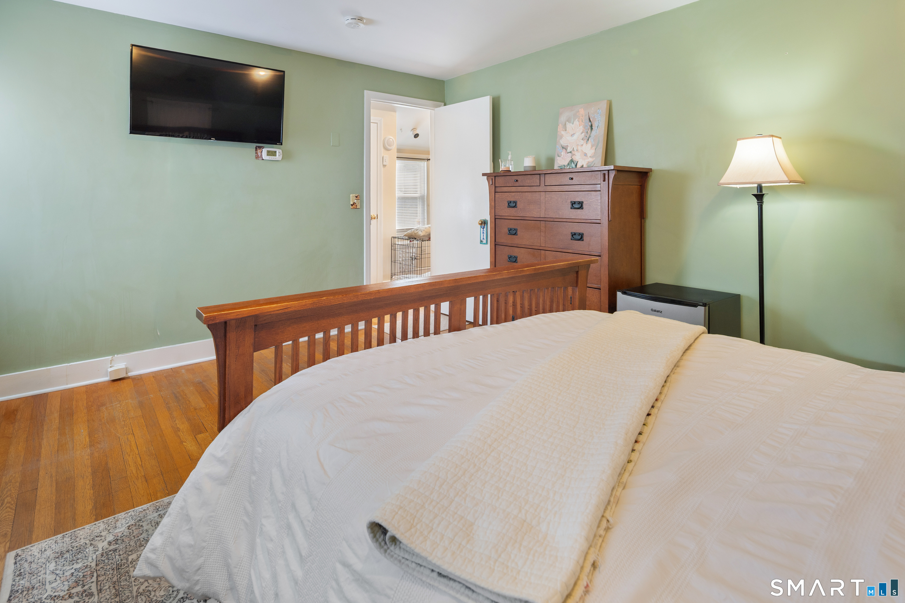 135 Laurel Place Bridgeport, CT 06604 - Photo 27 of 35 a bedroom with a bed and a flat screen tv