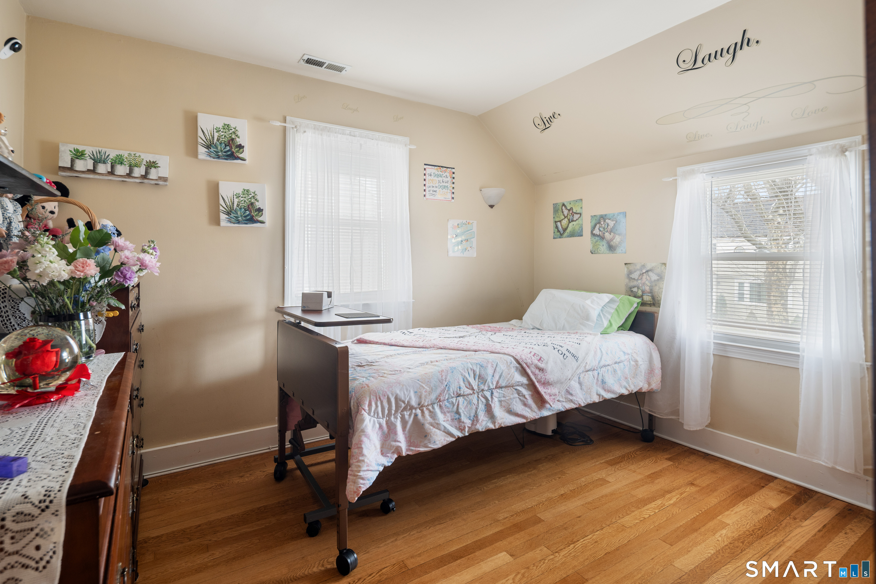 135 Laurel Place Bridgeport, CT 06604 - Photo 29 of 35 a bedroom with a bed and wooden floor