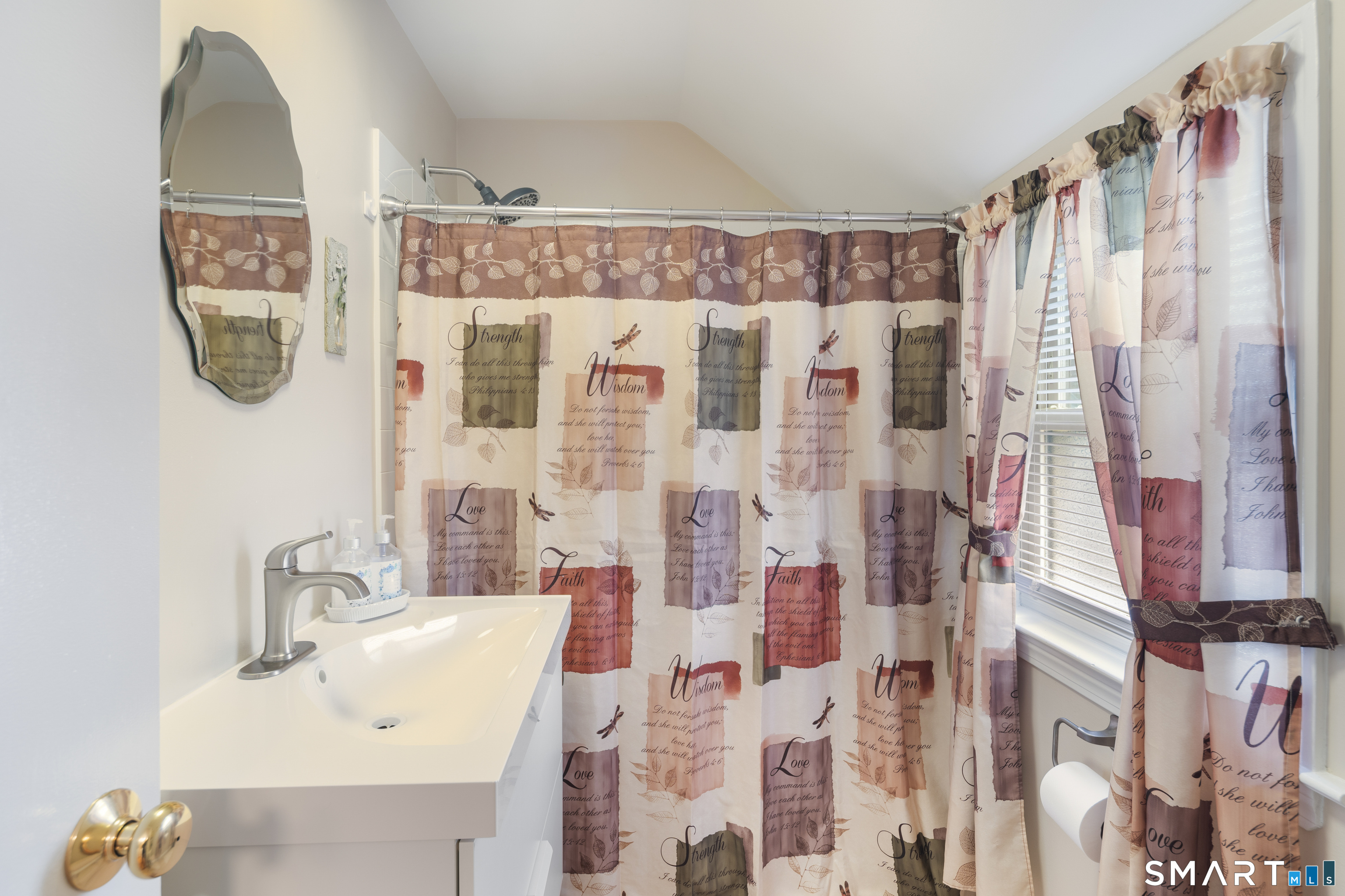 135 Laurel Place Bridgeport, CT 06604 - Photo 31 of 35 a bathroom with a sink and a mirror