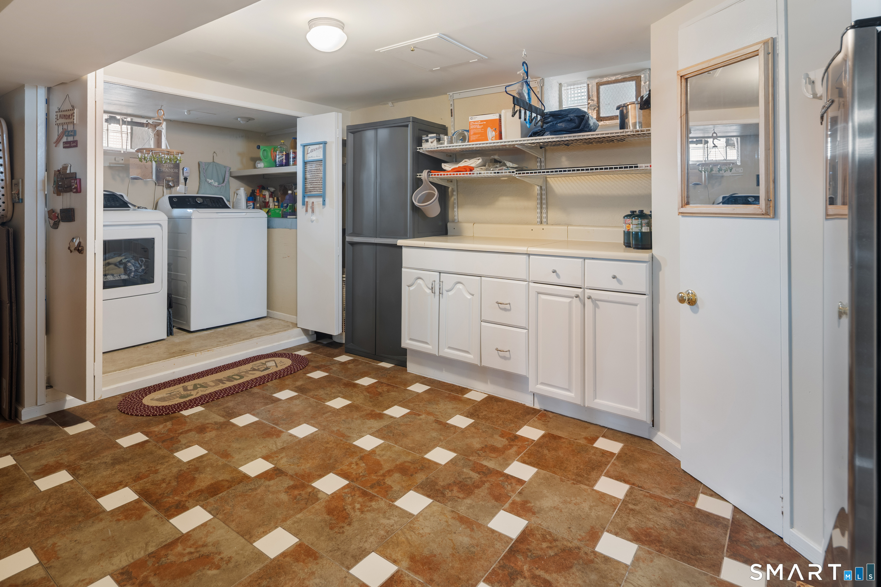 135 Laurel Place Bridgeport, CT 06604 - Photo 33 of 35 a kitchen with kitchen island a sink stove and refrigerator