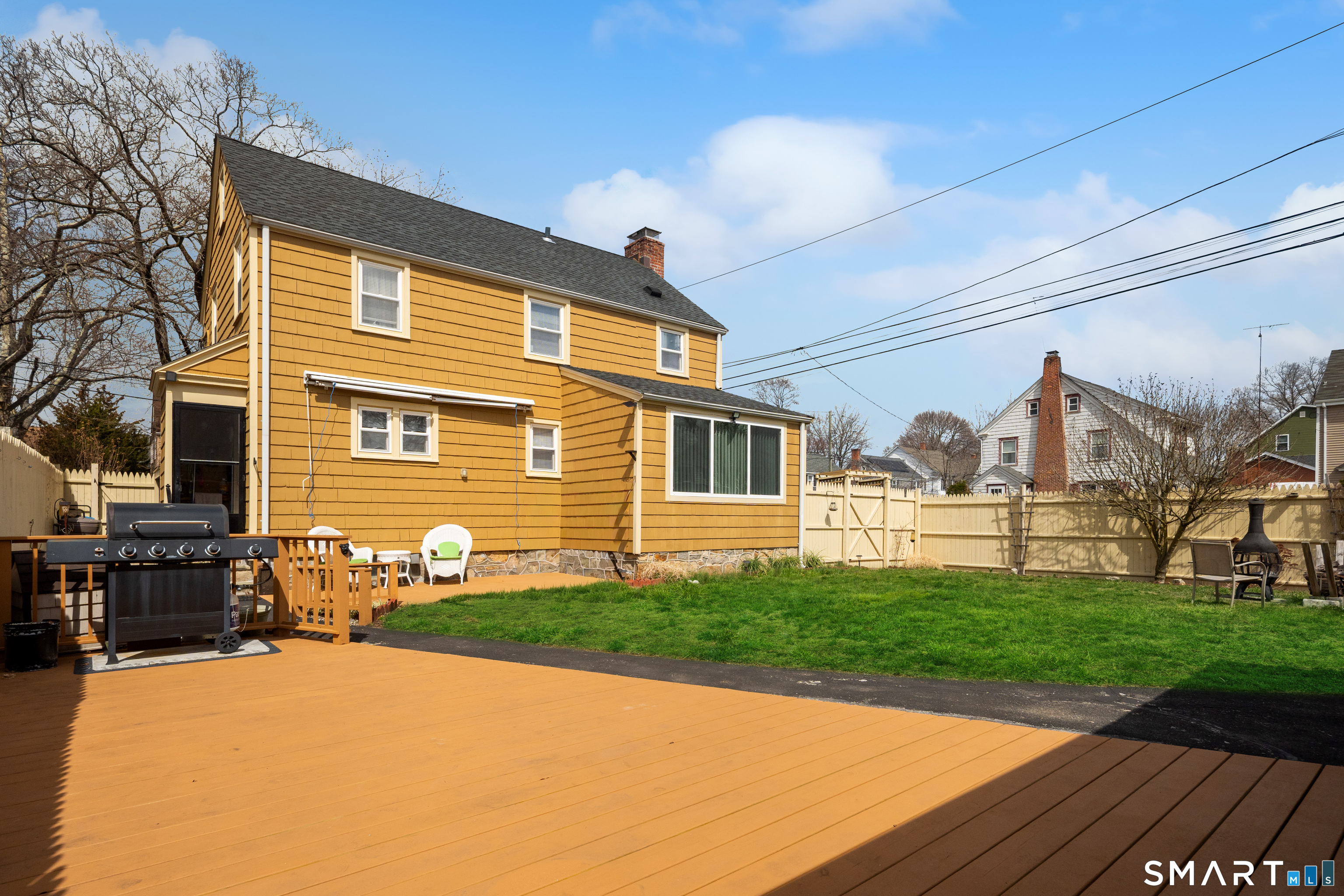 135 Laurel Place Bridgeport, CT 06604 - Photo 5 of 35 a front view of a house with a yard