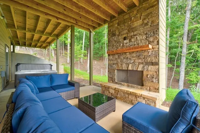a outdoor living space with furniture and a fireplace
