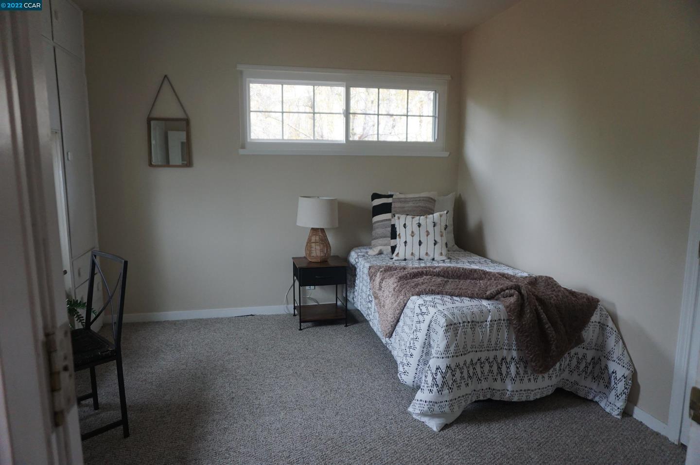 44 Anson Way Kensington, CA 94707 - Photo 16 of 22 a bedroom with a bed and a window