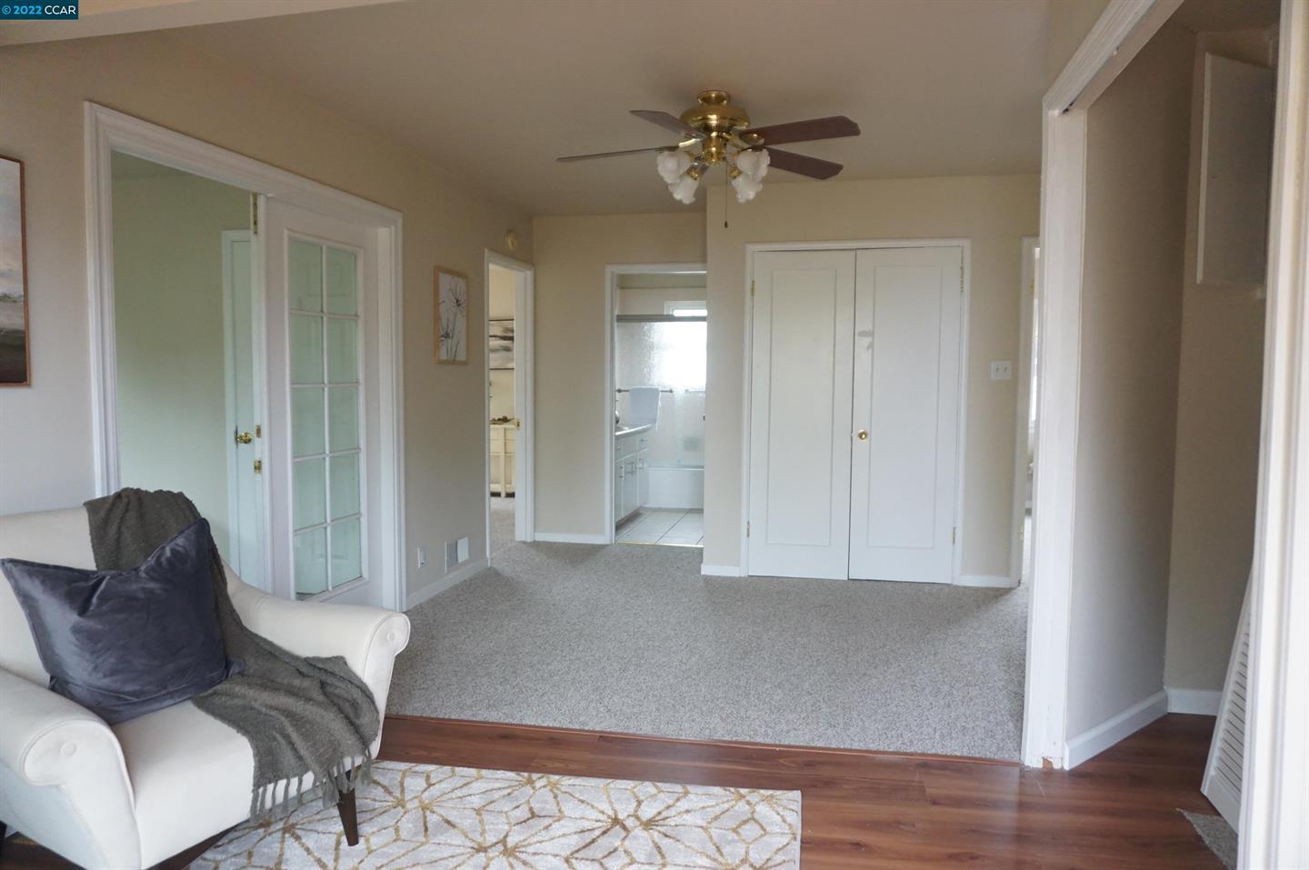 44 Anson Way Kensington, CA 94707 - Photo 17 of 22 a living room with furniture and a chandelier