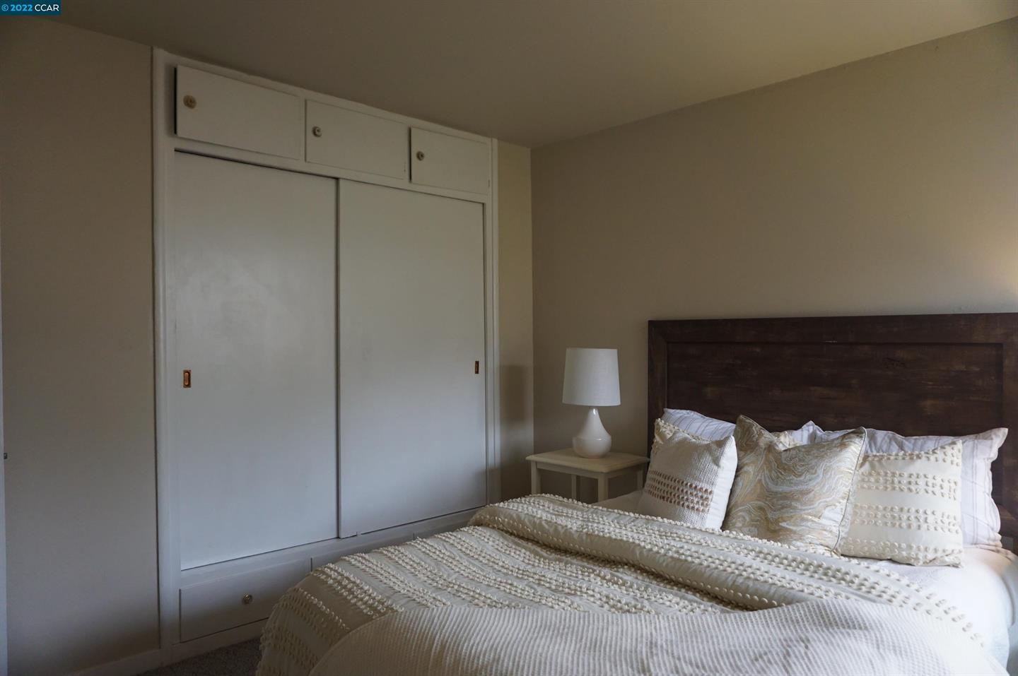 44 Anson Way Kensington, CA 94707 - Photo 8 of 22 a bedroom with a bed and a night stand