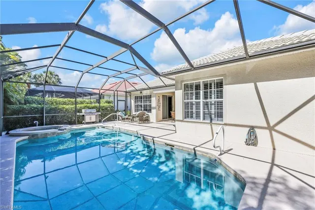 a view of a backyard with sitting area