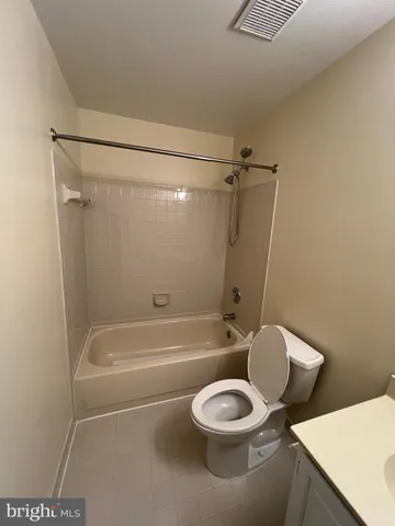 a bathroom with a toilet a sink and bathtub