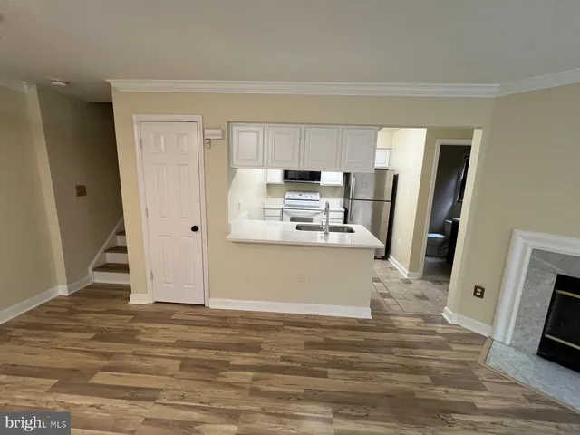 a view of kitchen and wooden floor