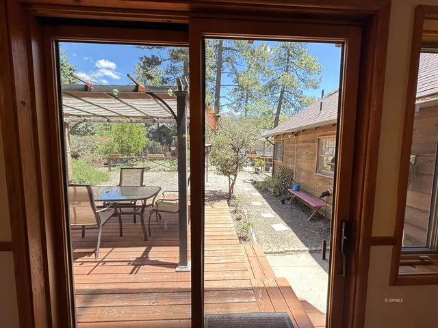 a room with a window and flowerpot