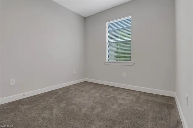 a bathroom with a granite countertop sink mirror toilet and bathtub