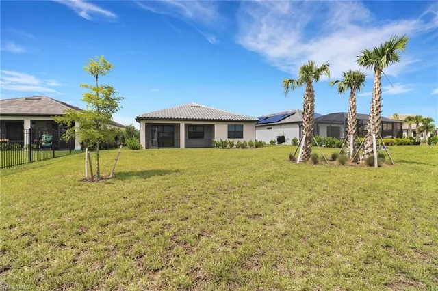 a view of a house with a yard
