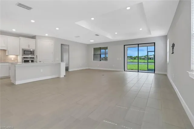 a view of a kitchen with a sink and a window