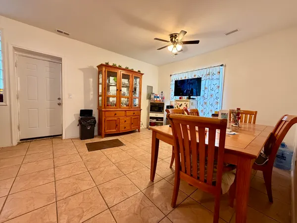 a view of a livingroom with furniture and a flat screen tv