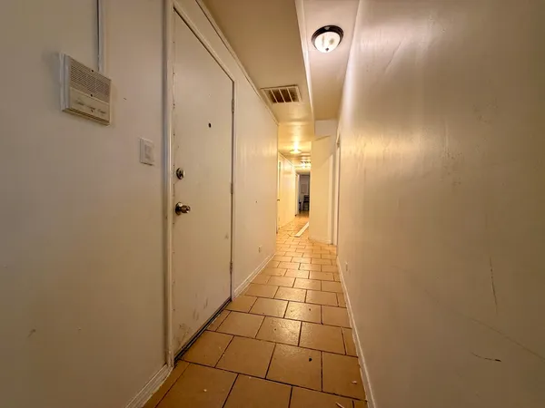 a bathroom with a glass door shower and a mirror