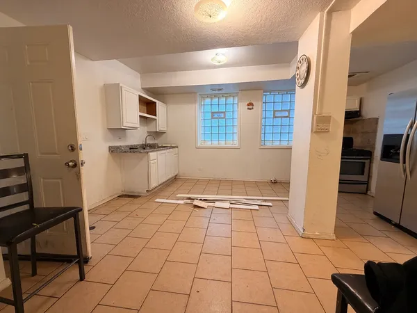 a view of an empty room with a window