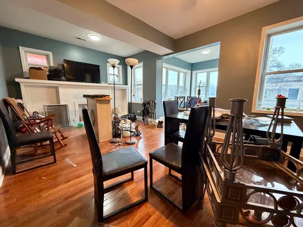 a view of a dining room with furniture window and wooden floor