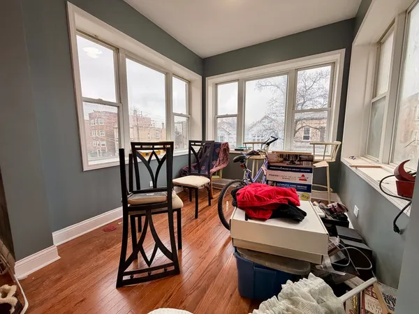 a bedroom with furniture and a window