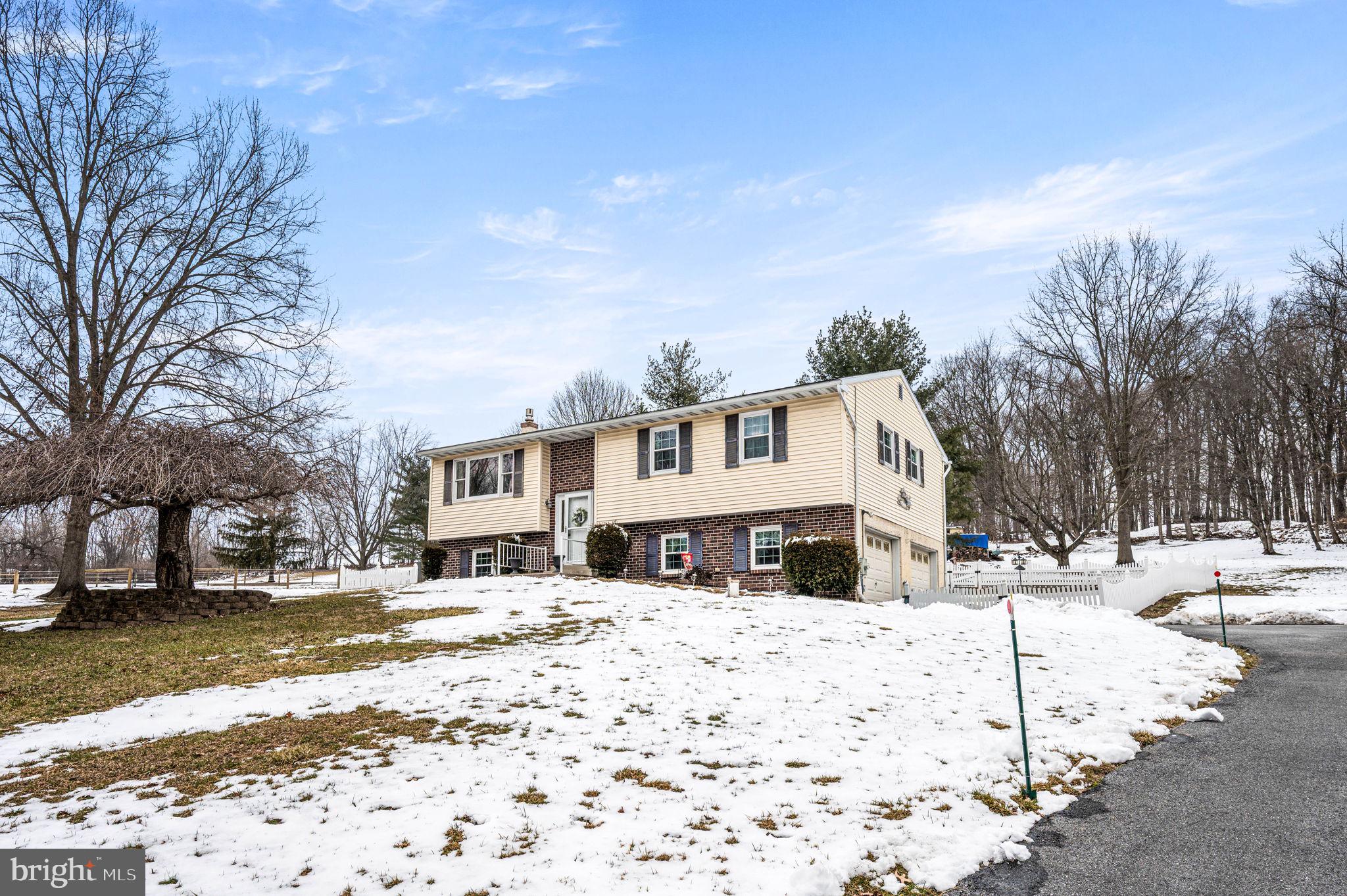 1548 County Line Road Bechtelsville, PA 19505 - Photo 1 of 31 a front view of a building with snow on the roadside