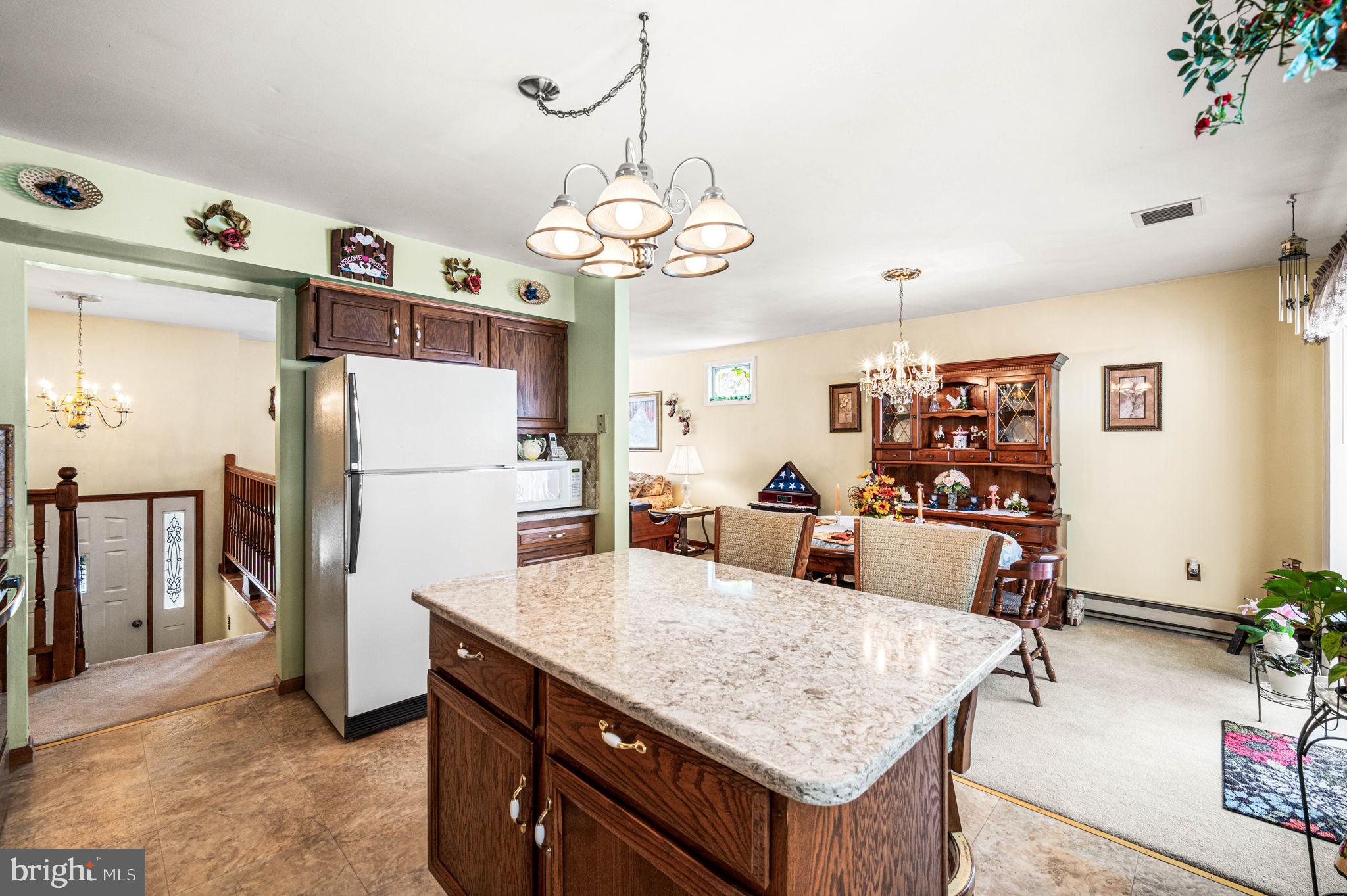 1548 County Line Road Bechtelsville, PA 19505 - Photo 11 of 31 a living room with dining table and chairs