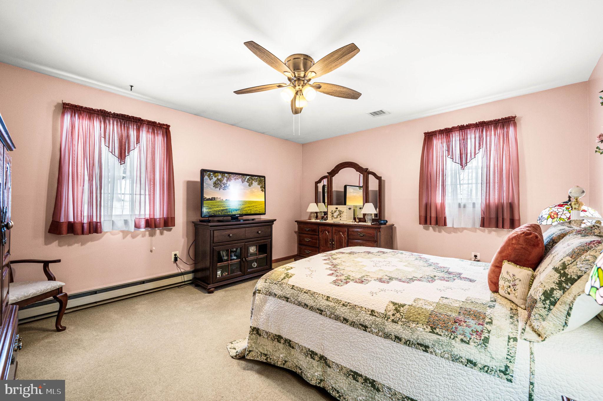 1548 County Line Road Bechtelsville, PA 19505 - Photo 13 of 31 a bedroom with a bed and a flat screen tv