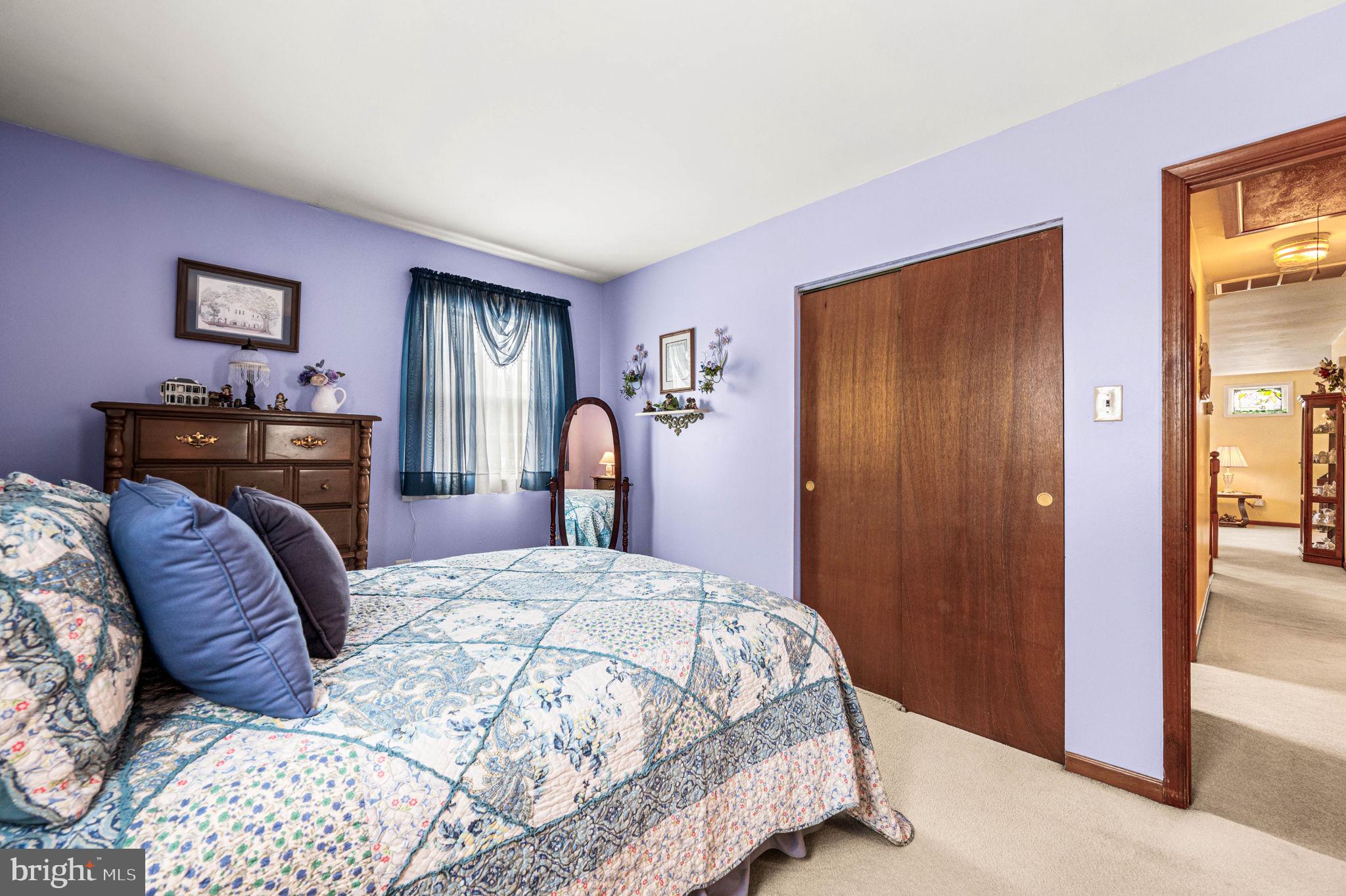 1548 County Line Road Bechtelsville, PA 19505 - Photo 16 of 31 a bedroom with a large bed and a dresser