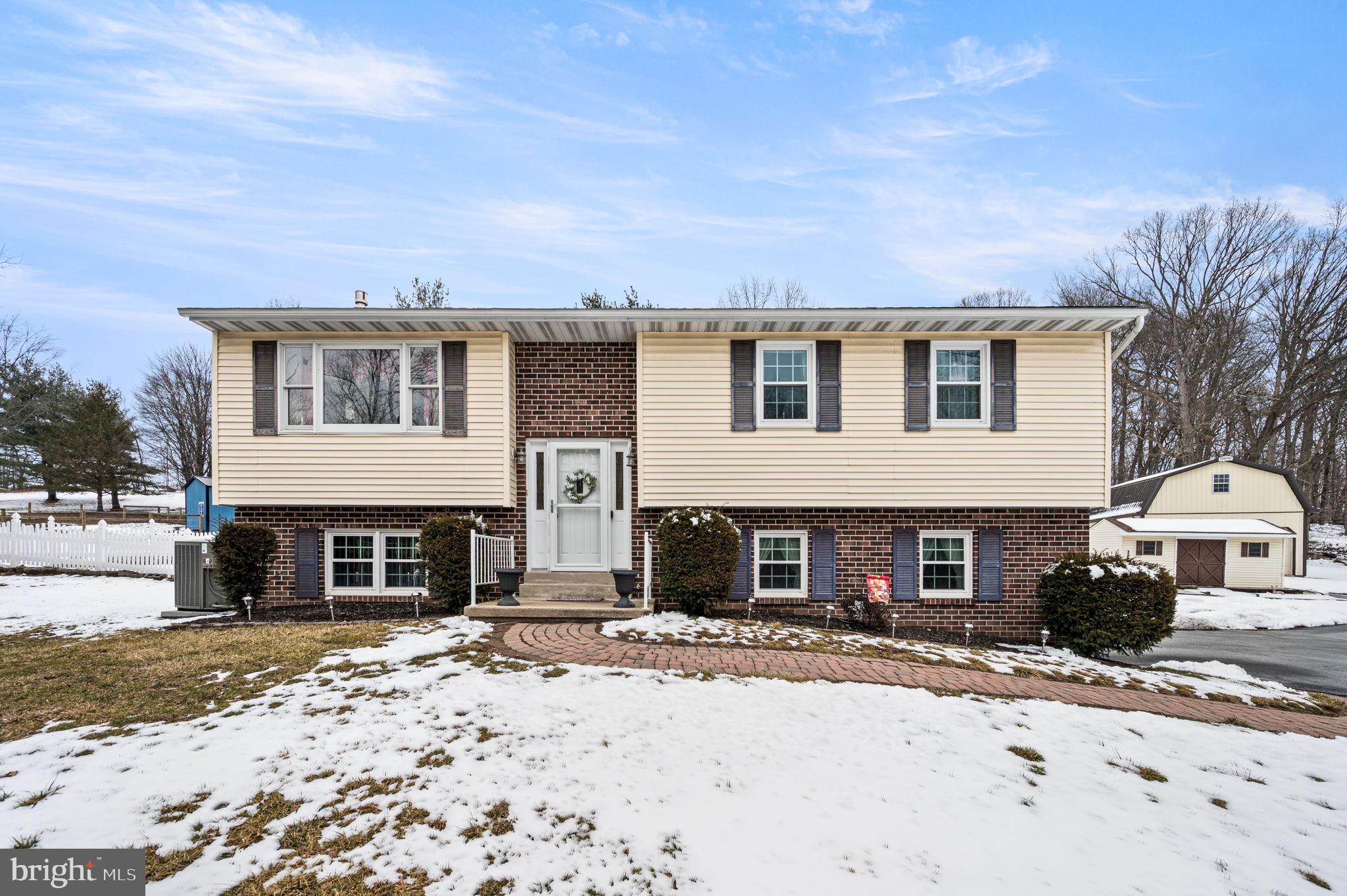 1548 County Line Road Bechtelsville, PA 19505 - Photo 2 of 31 a front view of a house with a yard