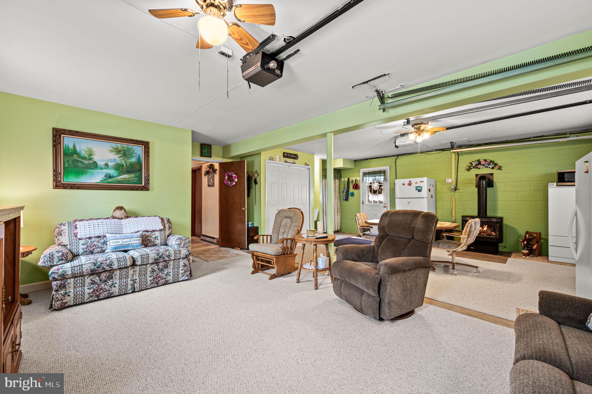 1548 County Line Road Bechtelsville, PA 19505 - Photo 23 of 31 a living room with furniture and a chandelier
