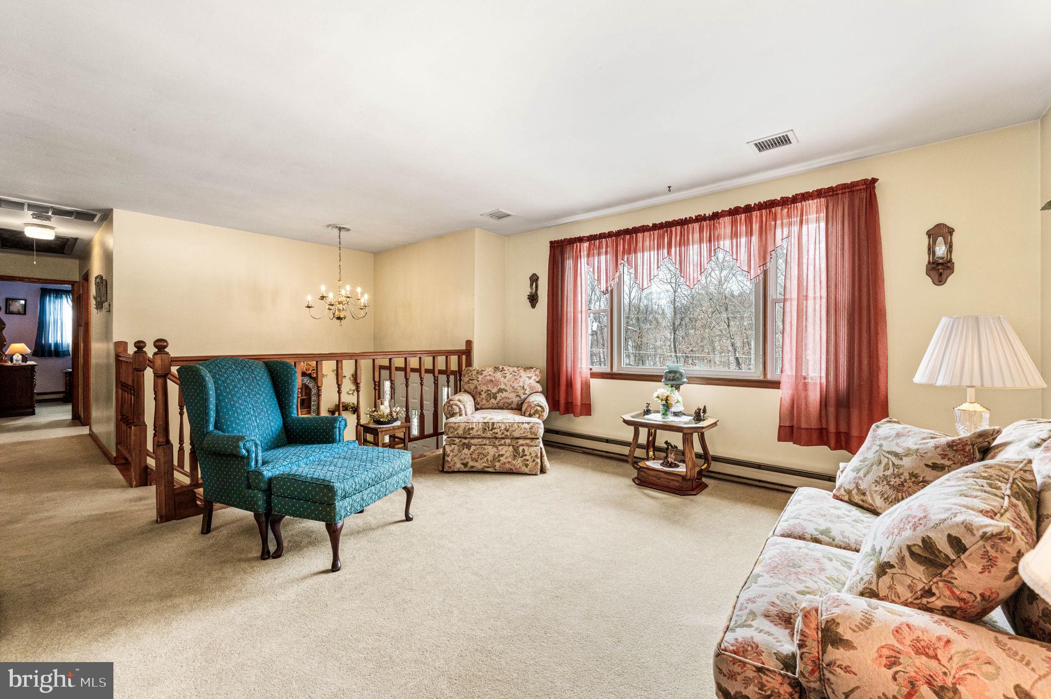 1548 County Line Road Bechtelsville, PA 19505 - Photo 4 of 31 a living room with furniture and a large window