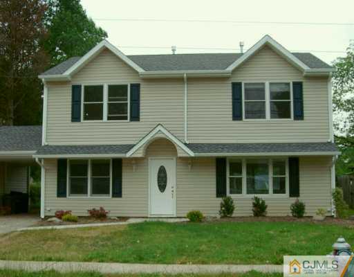 16 Dayton Road Edison, NJ 08817 - Photo 1 of 8 a front view of a house with a yard and barbeque oven