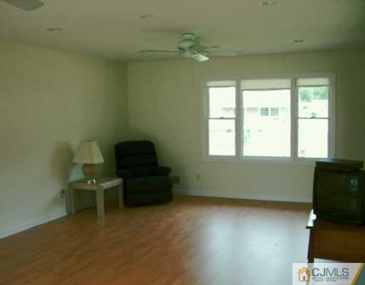 16 Dayton Road Edison, NJ 08817 - Photo 3 of 8 a living room with furniture and a window