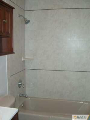 16 Dayton Road Edison, NJ 08817 - Photo 6 of 8 a bathroom with a shower