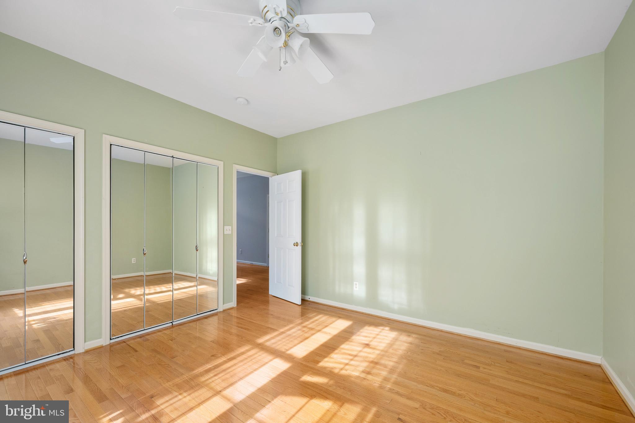 703 Yorktown Boulevard Locust Grove, VA 22508 - Photo 19 of 75 a view of a big room with wooden floor and windows