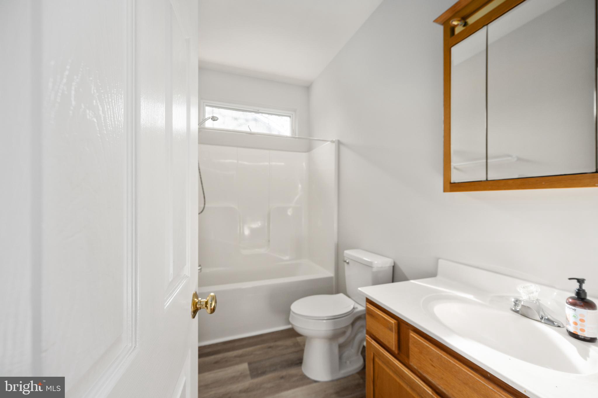703 Yorktown Boulevard Locust Grove, VA 22508 - Photo 20 of 75 a bathroom with a sink toilet and shower
