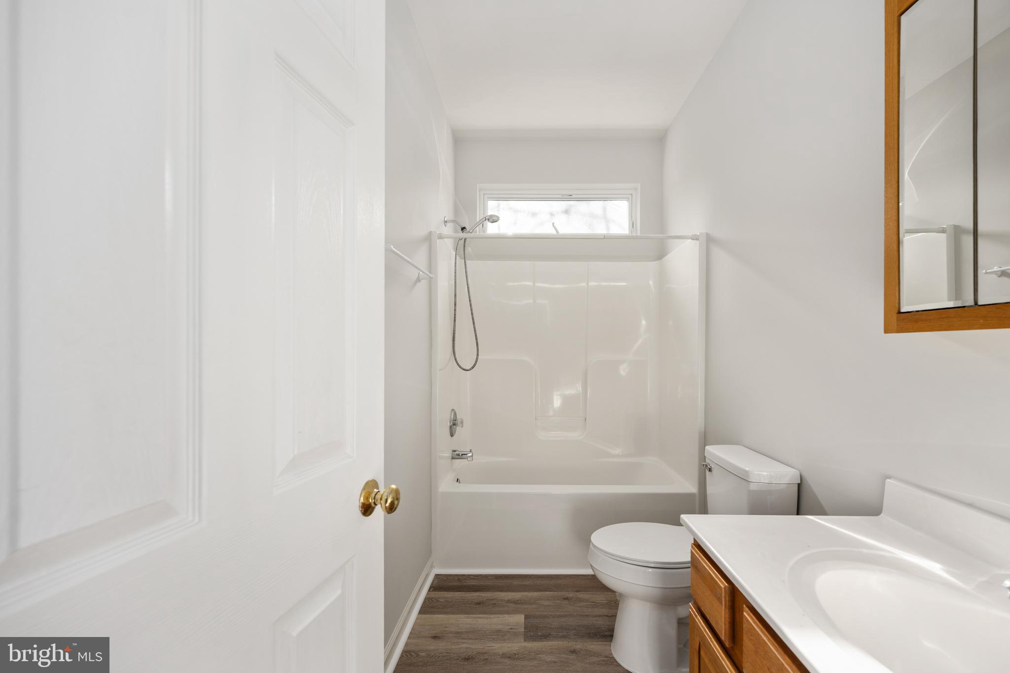 703 Yorktown Boulevard Locust Grove, VA 22508 - Photo 21 of 75 a bathroom with a sink a toilet and shower
