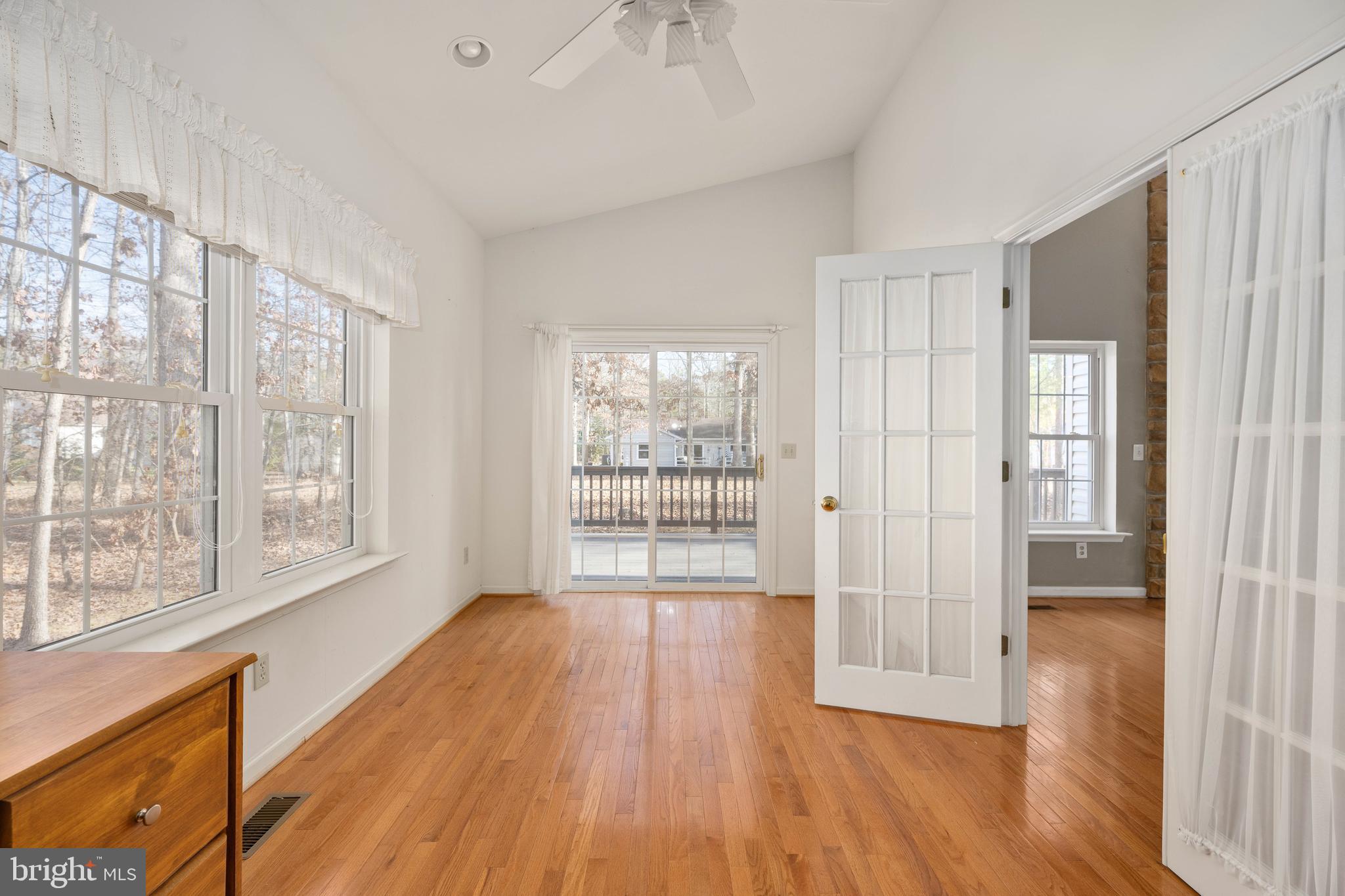 703 Yorktown Boulevard Locust Grove, VA 22508 - Photo 50 of 75 a view of an empty room with wooden floor and a window