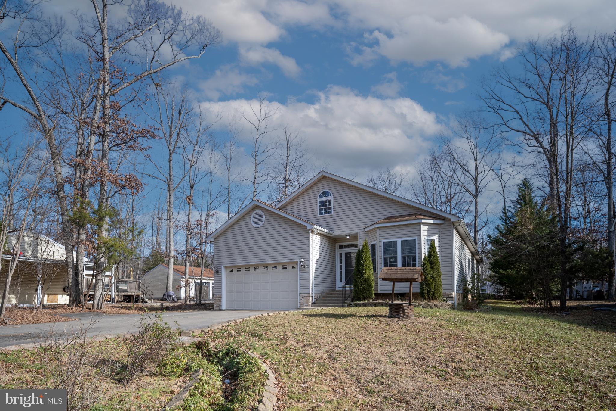 703 Yorktown Boulevard Locust Grove, VA 22508 - Photo 6 of 75 a view of a house with a yard