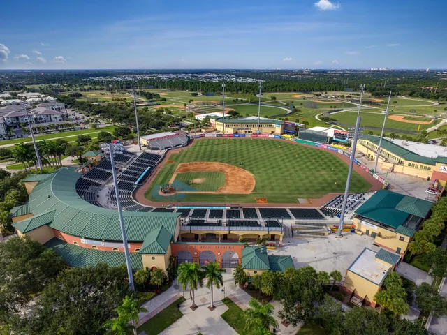 an aerial view of a house with a lake view